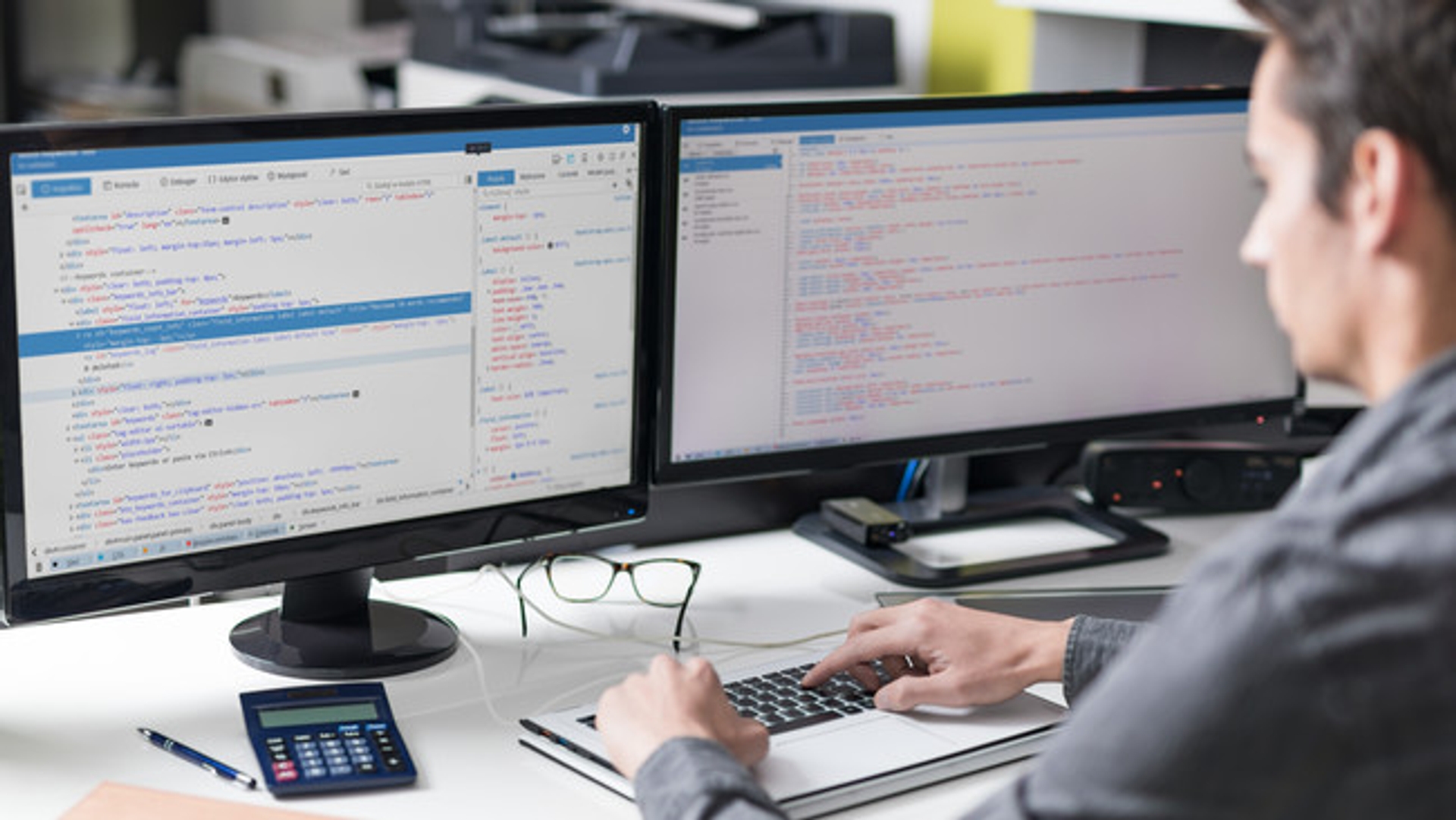 image: man working at screens