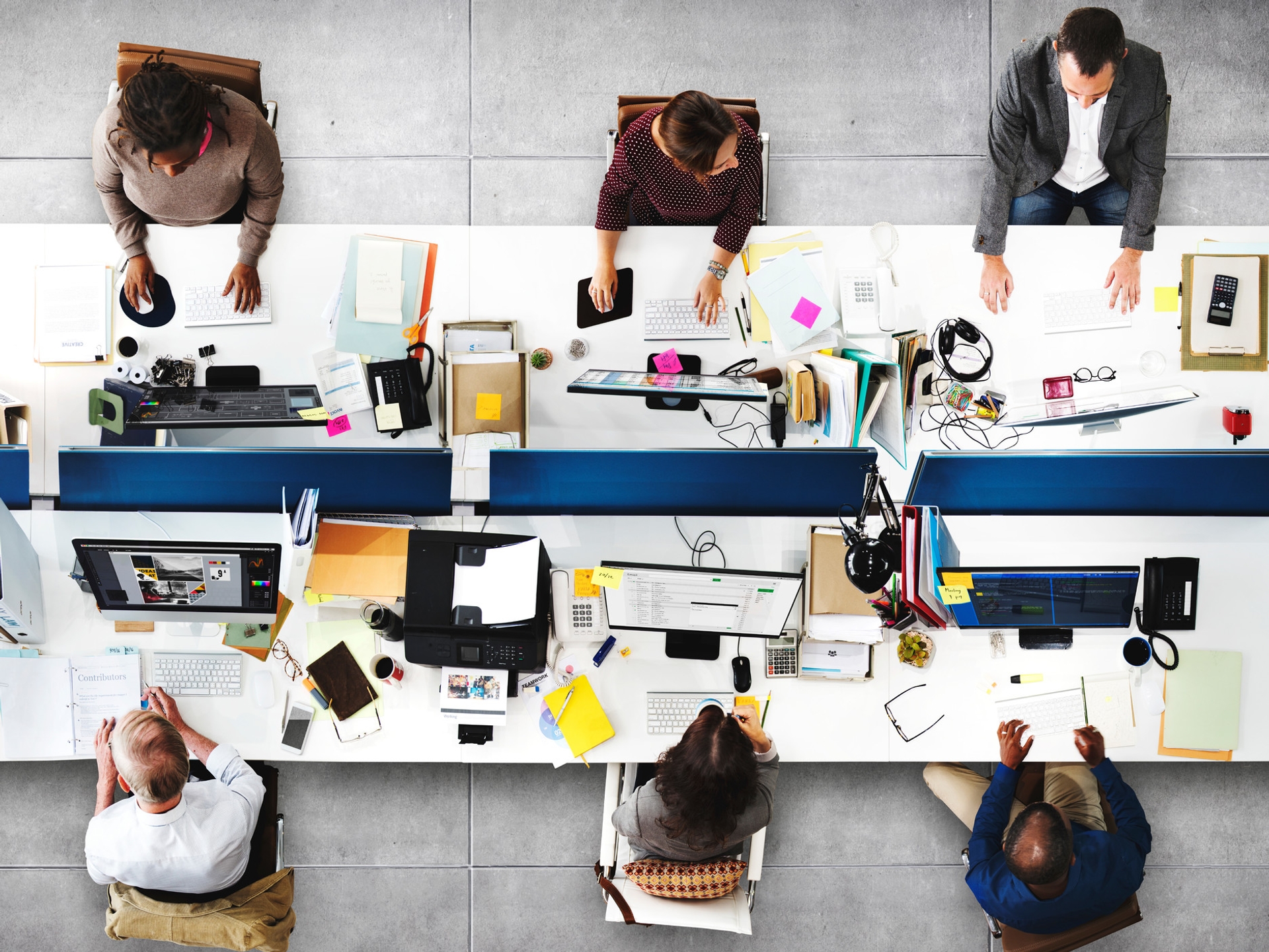 Overhead image of people sitting at computer desks