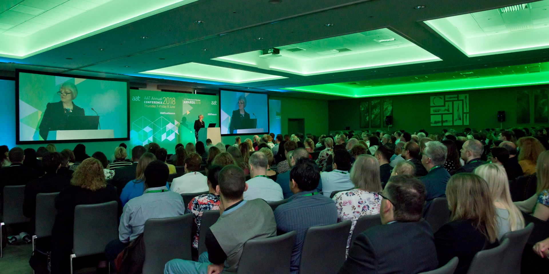 AAT conference showing the audience and a speaker on stage