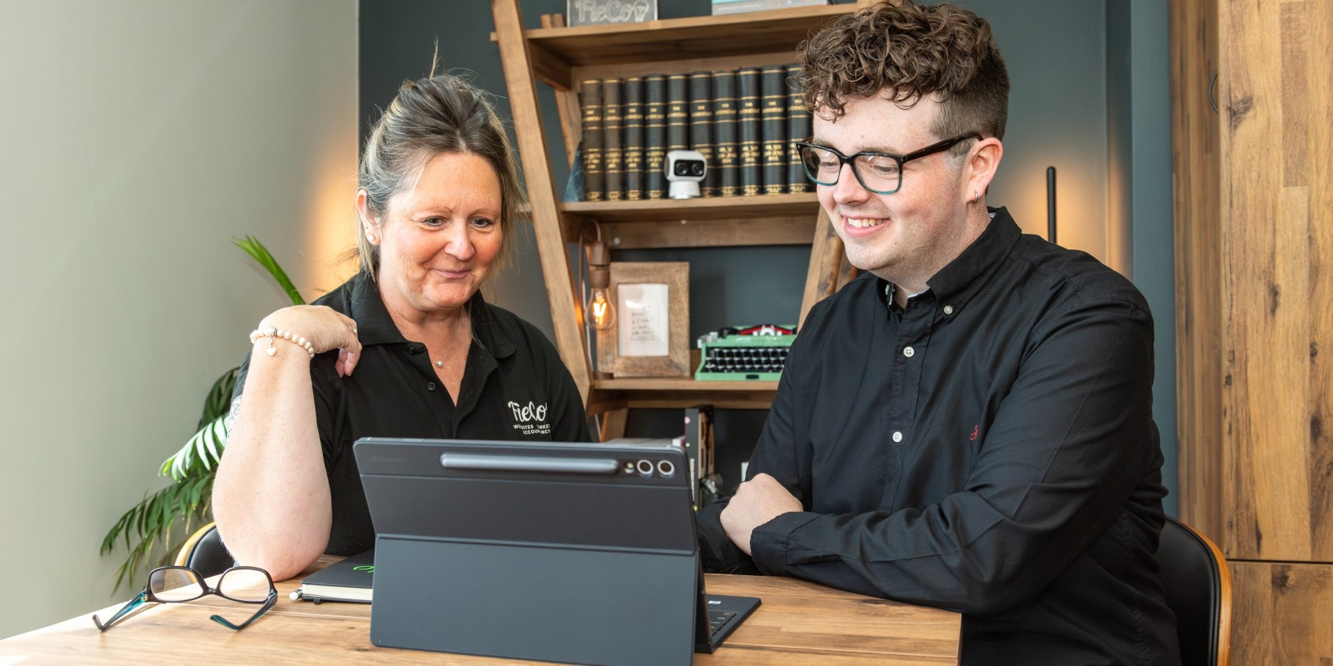 Two people speaking over a electronic device